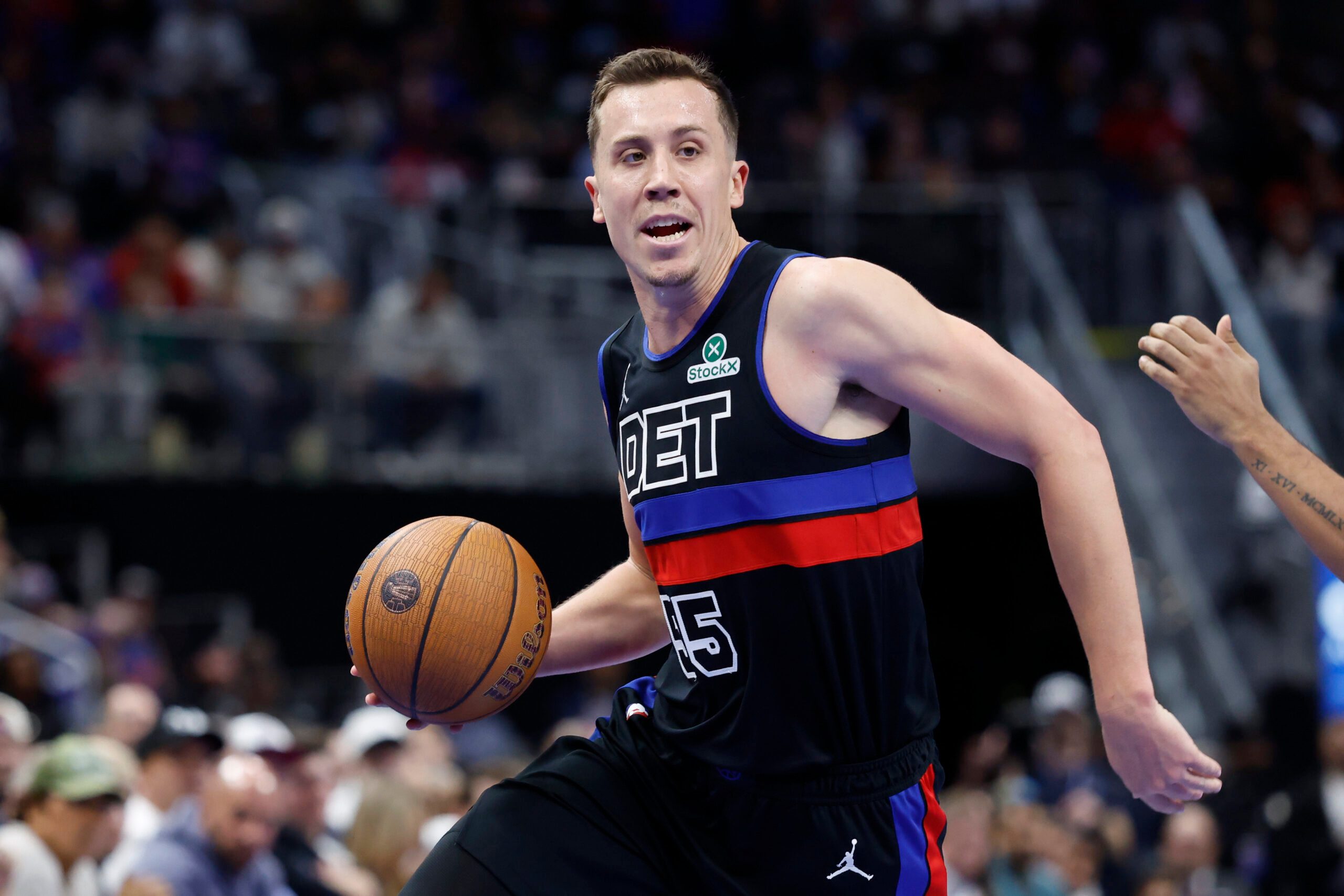 Nov 14, 2025; Detroit, Michigan, USA;  Detroit Pistons forward Duncan Robinson (55) dribbles in the second half against the Philadelphia 76ers at Little Caesars Arena. Mandatory Credit: Rick Osentoski-Imagn Images