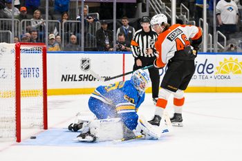 Nov 14, 2025; St. Louis, Missouri, USA; Philadelphia Flyers center Trevor Zegras (46) scores against St. Louis Blues goaltender Jordan Binnington (50) in shootouts at Enterprise Center. Mandatory Credit: Jeff Curry-Imagn Images