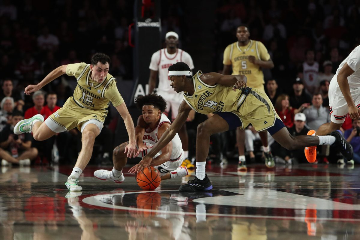 Nov 14, 2025; Athens, Georgia, USA; Georgia Bulldogs guard Jordan Ross (3) reaches for the ball against Georgia Tech Yellow Jackets guard Kam Craft (12) and Georgia Tech Yellow Jackets forward Kowacie Reeves Jr. (14) during the second half at Stegeman Coliseum. Mandatory Credit: Mady Mertens-Imagn Images
