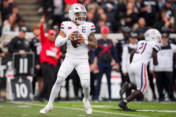 Nov 15, 2025; Cincinnati, Ohio, USA;  Arizona Wildcats quarterback Noah Fifita (1) drops back to pass against the Cincinnati Bearcats in the first half at Nippert Stadium. Mandatory Credit: Aaron Doster-Imagn Images