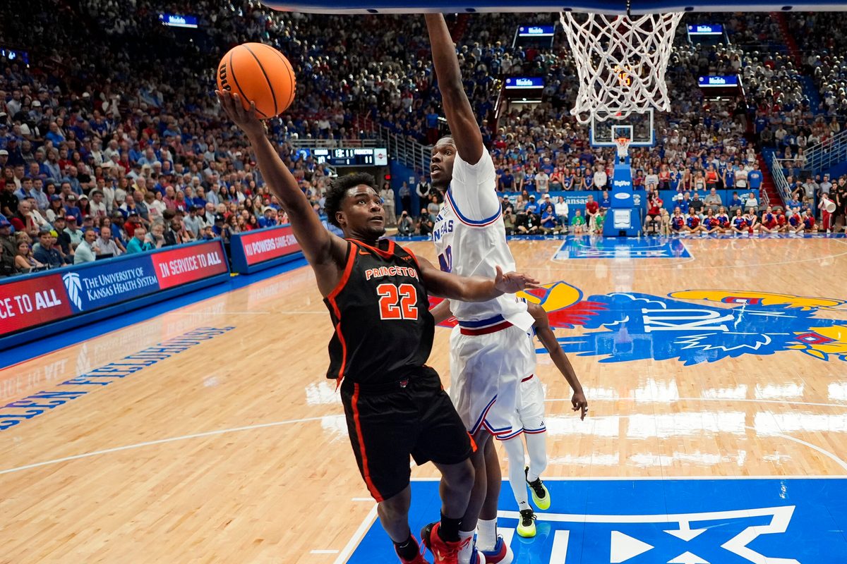 Nov 15, 2025; Lawrence, Kansas, USA; Princeton Tigers guard Dalen Davis (22) shoots against Kansas Jayhawks forward Flory Bidunga (40) during the first half at Allen Fieldhouse. Mandatory Credit: Jay Biggerstaff-Imagn Images