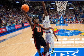 Nov 15, 2025; Lawrence, Kansas, USA; Princeton Tigers guard Dalen Davis (22) shoots against Kansas Jayhawks forward Flory Bidunga (40) during the first half at Allen Fieldhouse. Mandatory Credit: Jay Biggerstaff-Imagn Images