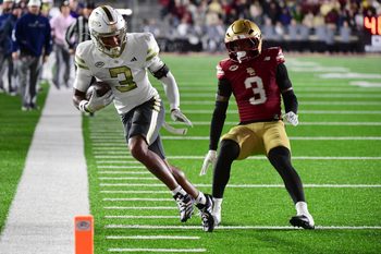 Nov 15, 2025; Chestnut Hill, Massachusetts, USA; Georgia Tech Yellow Jackets wide receiver Eric Rivers (3) runs with the ball while Boston College Eagles defensive back Max Tucker (3) defends during the second half at Alumni Stadium. Mandatory Credit: Bob DeChiara-Imagn Images
