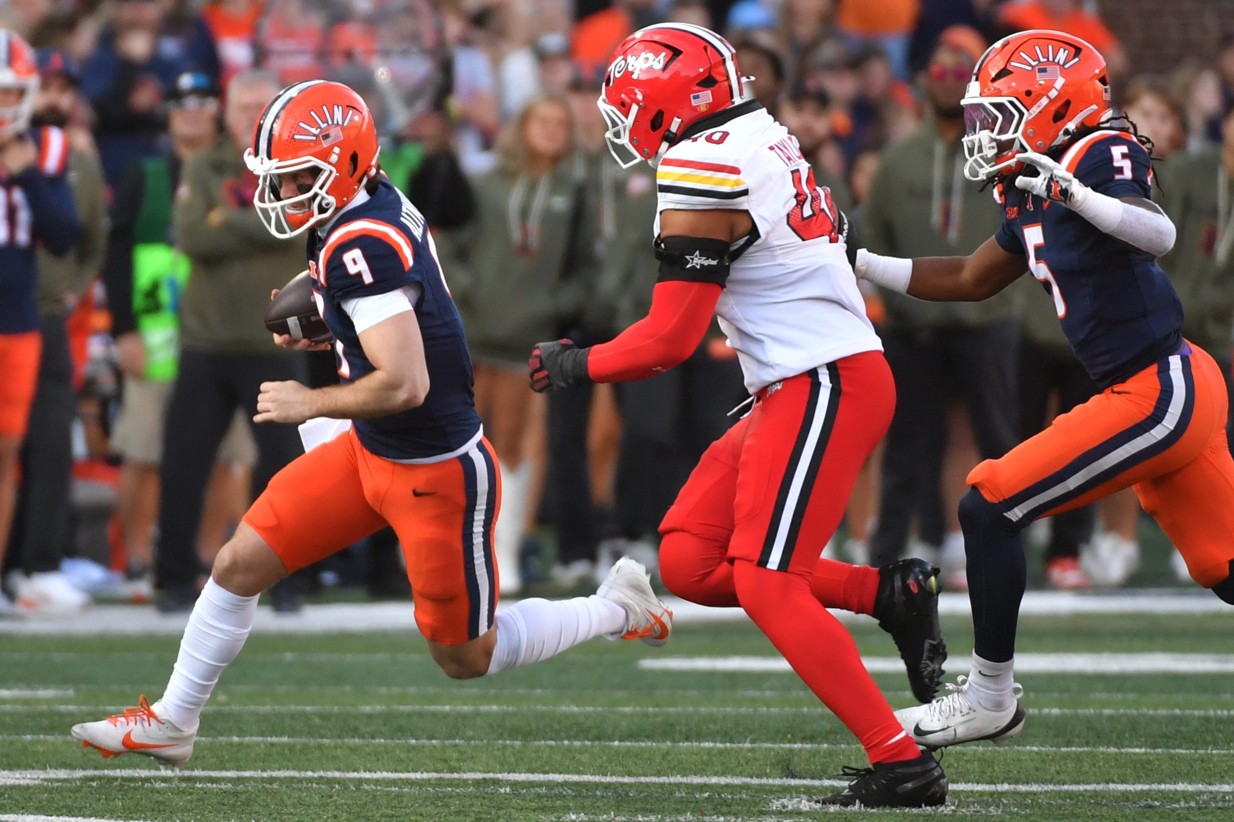 Nov 15, 2025; Champaign, Illinois, USA; Illinois Fighting Illini quarterback Luke Altmyer (9) runs the ball during the first half against the Maryland Terrapins at Memorial Stadium. Mandatory Credit: Ron Johnson-Imagn Images