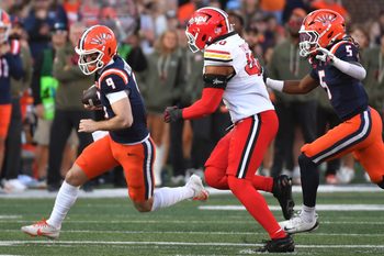 Nov 15, 2025; Champaign, Illinois, USA; Illinois Fighting Illini quarterback Luke Altmyer (9) runs the ball during the first half against the Maryland Terrapins at Memorial Stadium. Mandatory Credit: Ron Johnson-Imagn Images