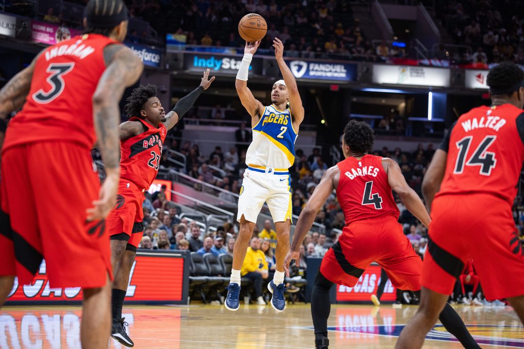 Nov 15, 2025; Indianapolis, Indiana, USA; Indiana Pacers guard/forward Andrew Nembhard (2) shoots the ball while Toronto Raptors guard Jamal Shead (23) defends in the second half at Gainbridge Fieldhouse. Mandatory Credit: Trevor Ruszkowski-Imagn Images