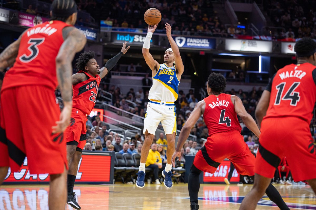 Nov 15, 2025; Indianapolis, Indiana, USA; Indiana Pacers guard/forward Andrew Nembhard (2) shoots the ball while Toronto Raptors guard Jamal Shead (23) defends in the second half at Gainbridge Fieldhouse. Mandatory Credit: Trevor Ruszkowski-Imagn Images