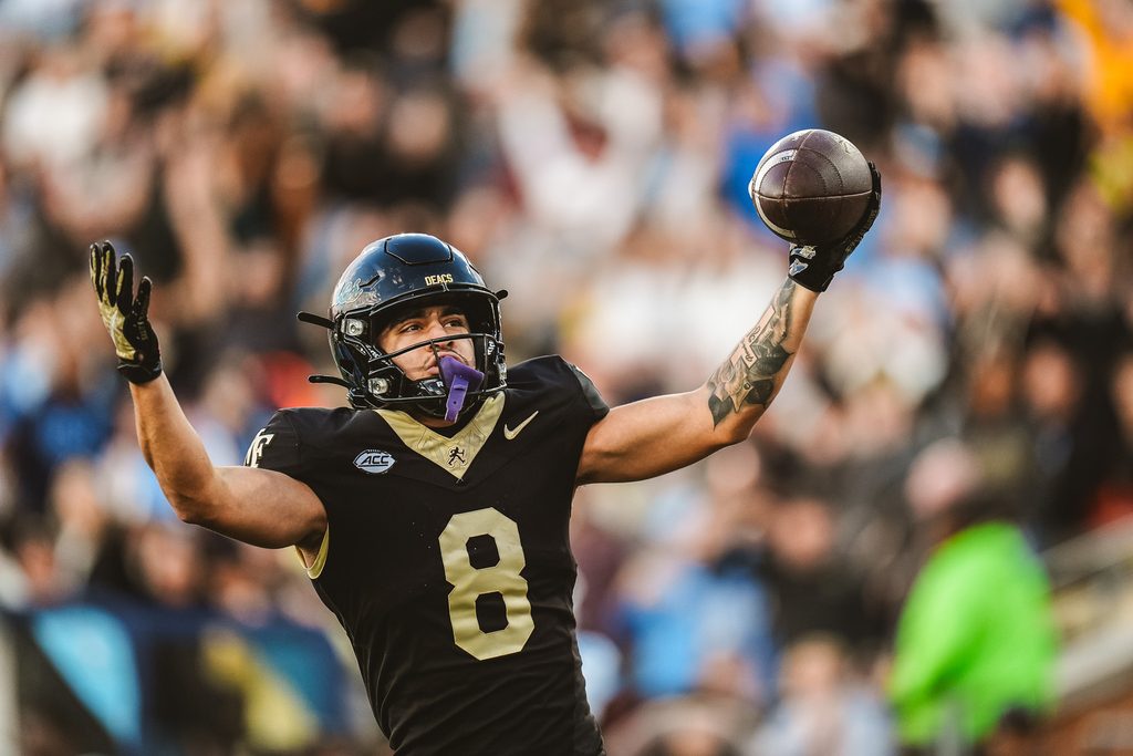 Nov 15, 2025; Winston-Salem, North Carolina, USA; Wake Forest Demon Deacons wide receiver Carlos Hernandez (8) reacts after a play against the North Carolina Tar Heels at Allegacy Federal Credit Union Stadium. Mandatory Credit: Wake Forest Athletics via Imagn Images