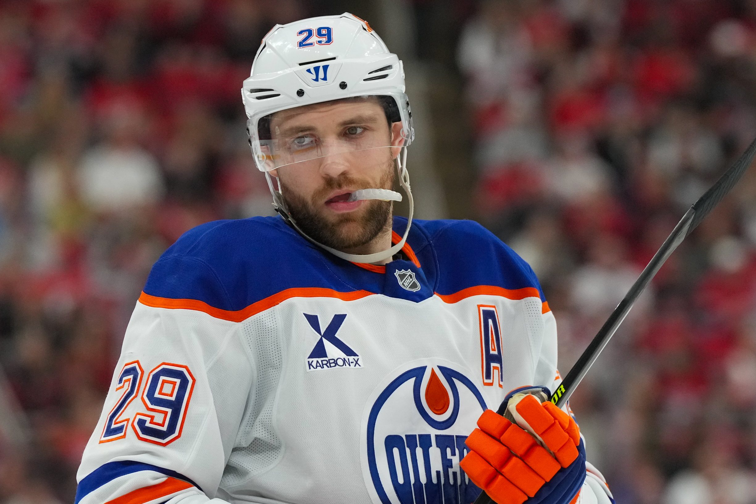 Nov 15, 2025; Raleigh, North Carolina, USA;  Edmonton Oilers center Leon Draisaitl (29) looks on against the Carolina Hurricanes during the second period at Lenovo Center. Mandatory Credit: James Guillory-Imagn Images