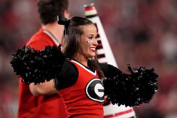 Nov 15, 2025; Athens, Georgia, USA; A Georgia Bulldogs cheerleader performs in the first half against the Texas Longhorns at Sanford Stadium. Mandatory Credit: Dale Zanine-Imagn Images