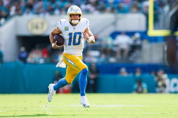 Nov 16, 2025; Jacksonville, Florida, USA; Los Angeles Chargers quarterback Justin Herbert (10) rushes against the Jacksonville Jaguars during the second quarter at EverBank Stadium. Mandatory Credit: Nathan Ray Seebeck-Imagn Images