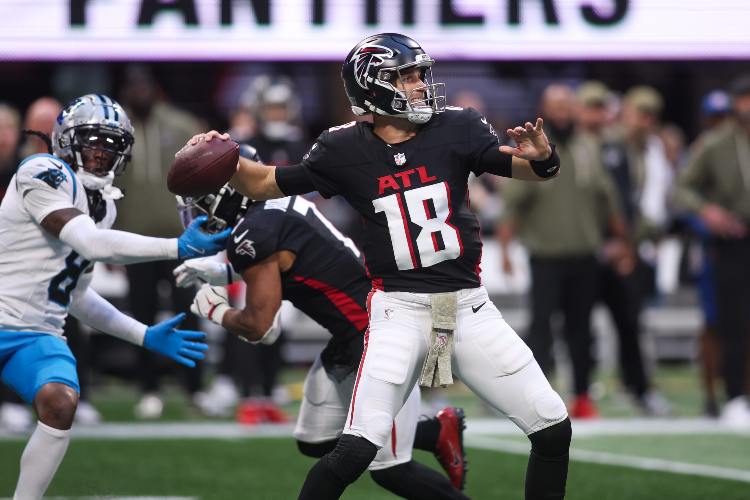Nov 16, 2025; Atlanta, Georgia, USA; Atlanta Falcons quarterback Kirk Cousins (18) looks to throw the ball in the fourth quarter against the Carolina Panthers at Mercedes-Benz Stadium. Mandatory Credit: Brett Davis-Imagn Images