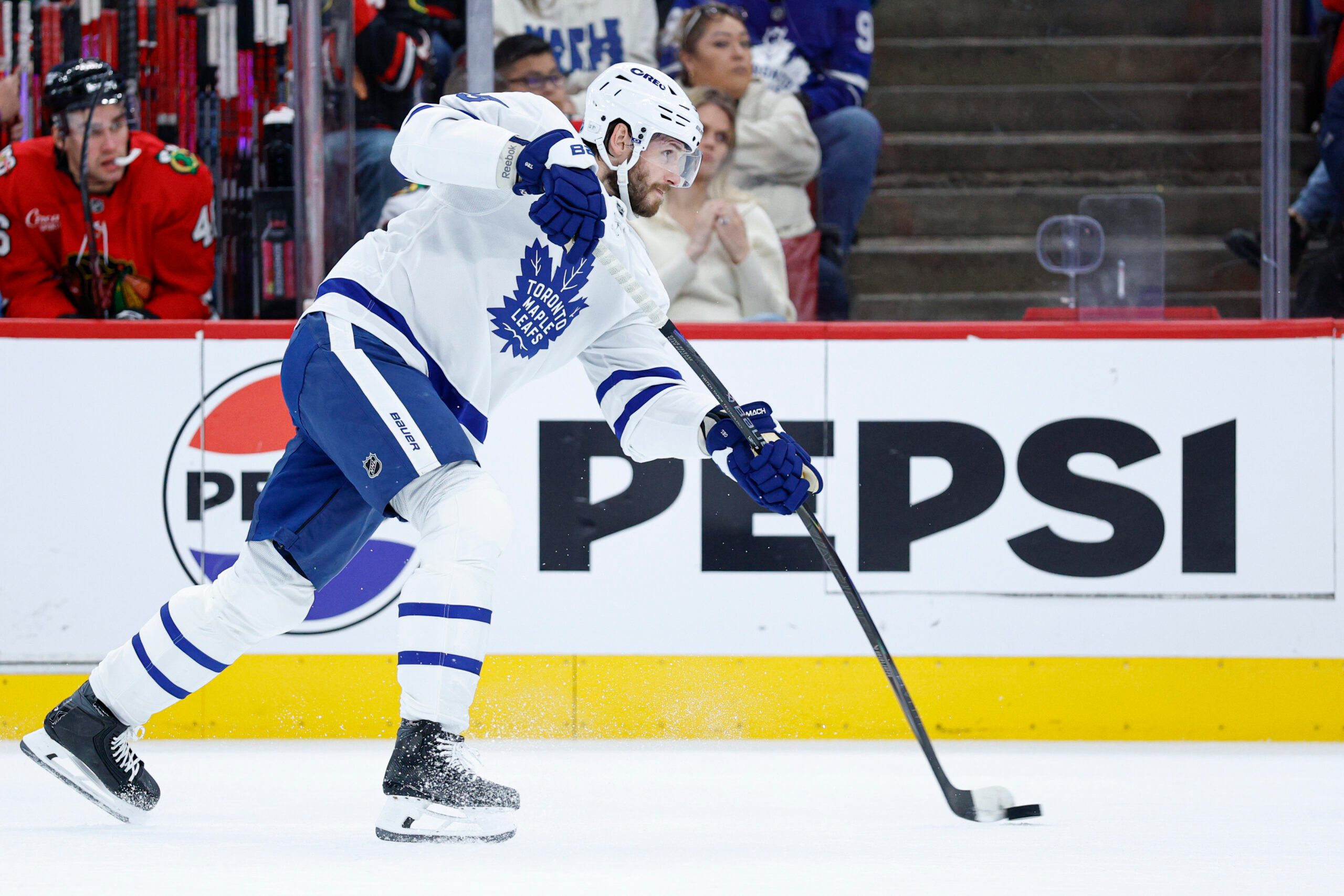 Nov 15, 2025; Chicago, Illinois, USA; Toronto Maple Leafs defenseman Oliver Ekman-Larsson (95) shoots against the Chicago Blackhawks during the first period at United Center. Mandatory Credit: Kamil Krzaczynski-Imagn Images