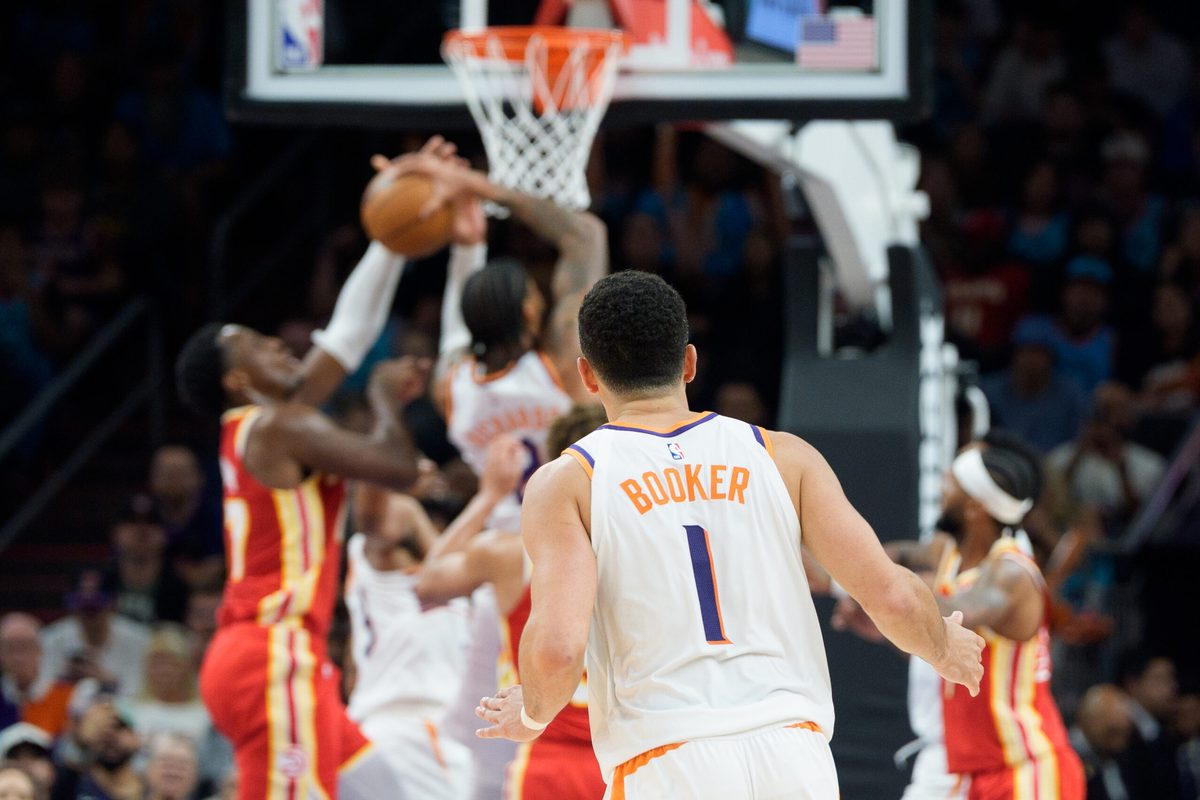 Nov 16, 2025; Phoenix, Arizona, USA; A general view as Phoenix Suns guard Devin Booker (1) watches play under the basket from center court during the second half of a game against Atlanta Hawks at Mortgage Matchup Center. Mandatory Credit: Allan Henry-Imagn Images
