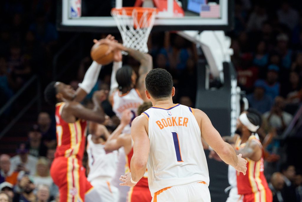 Nov 16, 2025; Phoenix, Arizona, USA; A general view as Phoenix Suns guard Devin Booker (1) watches play under the basket from center court during the second half of a game against Atlanta Hawks at Mortgage Matchup Center. Mandatory Credit: Allan Henry-Imagn Images