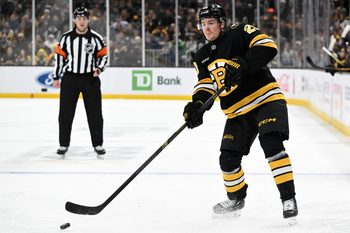 Nov 17, 2025; Boston, Massachusetts, USA; Boston Bruins center Alex Steeves (21) passes the puck against the Carolina Hurricanes during the first period at the TD Garden. Mandatory Credit: Brian Fluharty-Imagn Images