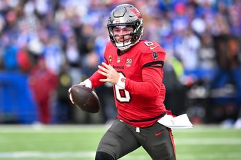 Nov 16, 2025; Orchard Park, New York, USA; Tampa Bay Buccaneers quarterback Baker Mayfield (6) runs out of the pocket in the second quarter against the Buffalo Bills at Highmark Stadium. Mandatory Credit: Mark Konezny-Imagn Images