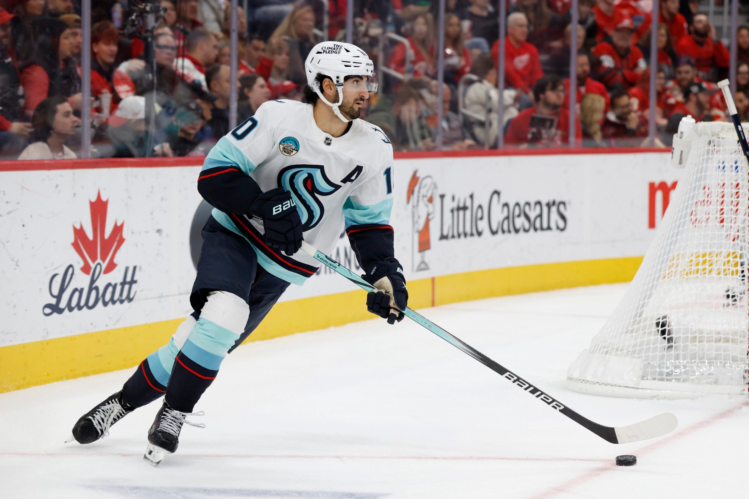 Nov 18, 2025; Detroit, Michigan, USA; Seattle Kraken center Matty Beniers (10) skates with the puck in the second period against the Detroit Red Wings at Little Caesars Arena. Mandatory Credit: Rick Osentoski-Imagn Images