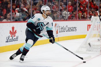 Nov 18, 2025; Detroit, Michigan, USA; Seattle Kraken center Matty Beniers (10) skates with the puck in the second period against the Detroit Red Wings at Little Caesars Arena. Mandatory Credit: Rick Osentoski-Imagn Images