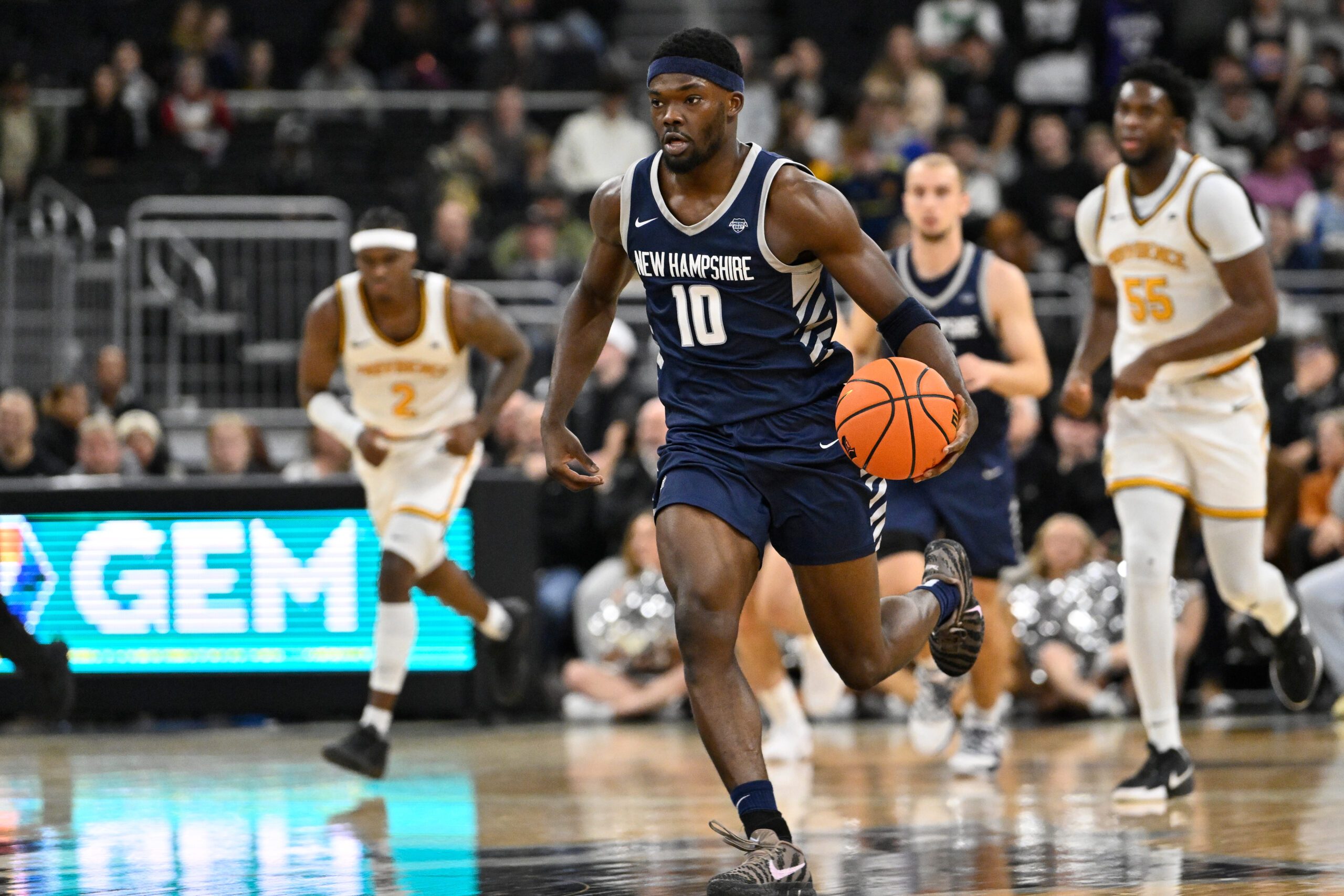 Nov 18, 2025; Providence, Rhode Island, USA; New Hampshire Wildcats guard Comeh Emuobor (10) dribbles the ball during the second half against the Providence Friars at Amica Mutual Pavilion. Mandatory Credit: Eric Canha-Imagn Images