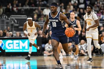 Nov 18, 2025; Providence, Rhode Island, USA; New Hampshire Wildcats guard Comeh Emuobor (10) dribbles the ball during the second half against the Providence Friars at Amica Mutual Pavilion. Mandatory Credit: Eric Canha-Imagn Images