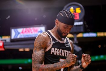 Nov 18, 2025; Atlanta, Georgia, USA; Atlanta Hawks guard Nickeil Alexander-Walker (7) reacts after a basket against the Detroit Pistons in the fourth quarter at State Farm Arena. Mandatory Credit: Brett Davis-Imagn Images