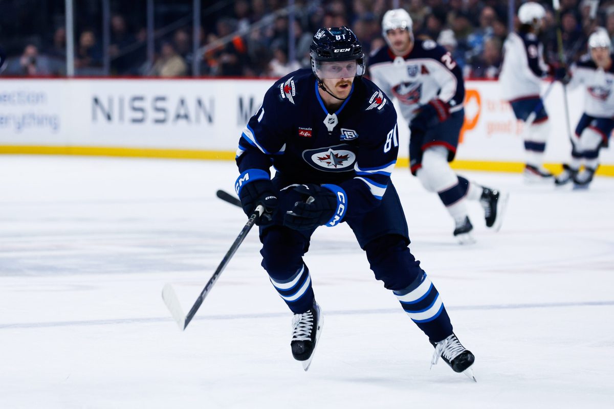Nov 18, 2025; Winnipeg, Manitoba, CAN;  Winnipeg Jets forward Kyle Connor (81) skies after the puck in the Colorado Avalanche zone during the first period at Canada Life Centre. Mandatory Credit: Terrence Lee-Imagn Images