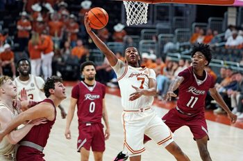 Nov 18, 2025; Austin, Texas, USA; Texas Longhorns guard Simeon Wilcher (7) makes a lay up against Rider Broncs guard Flash Burton (11) during the second half at Moody Center. Mandatory Credit: Dustin Safranek-Imagn Images