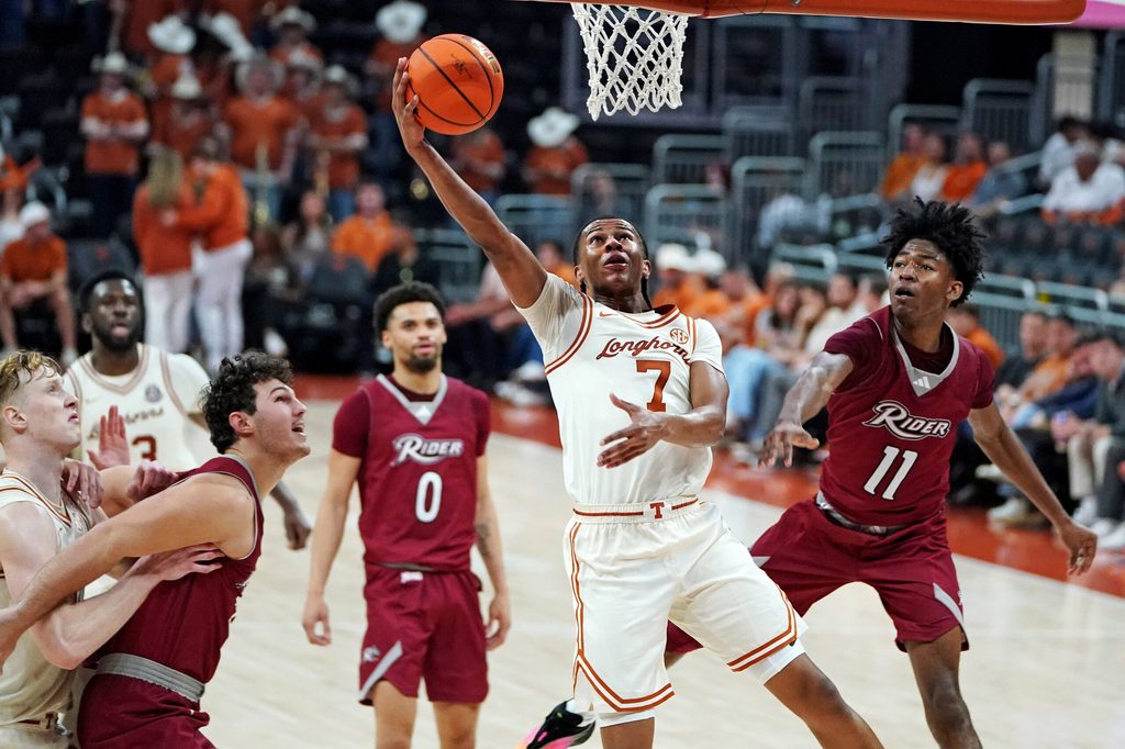 Nov 18, 2025; Austin, Texas, USA; Texas Longhorns guard Simeon Wilcher (7) makes a lay up against Rider Broncs guard Flash Burton (11) during the second half at Moody Center. Mandatory Credit: Dustin Safranek-Imagn Images