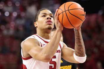 Nov 18, 2025; Fayetteville, Arkansas, USA; Arkansas Razorbacks guard Darius Acuff Jr (5) shoots a free throw against the Winthrop Eagles during the first half at Bud Walton Arena. Arkansas won 84-83. Mandatory Credit: Nelson Chenault-Imagn Images