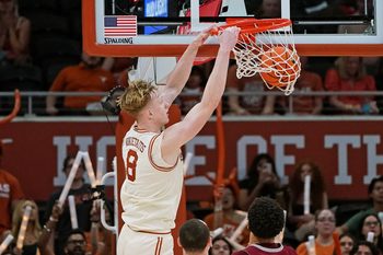 Nov 18, 2025; Austin, Texas, USA; Texas Longhorns center Matas Vokietaitis (8) dunks against the Rider Broncs during the second half at Moody Center. Mandatory Credit: Dustin Safranek-Imagn Images