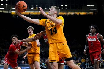 Iowa guard Bennett Stirtz (14) drives to the basket against the Southeast Missouri Red Hawks Nov. 18, 2025 at Carver-Hawkeye Arena in Iowa City, Iowa.