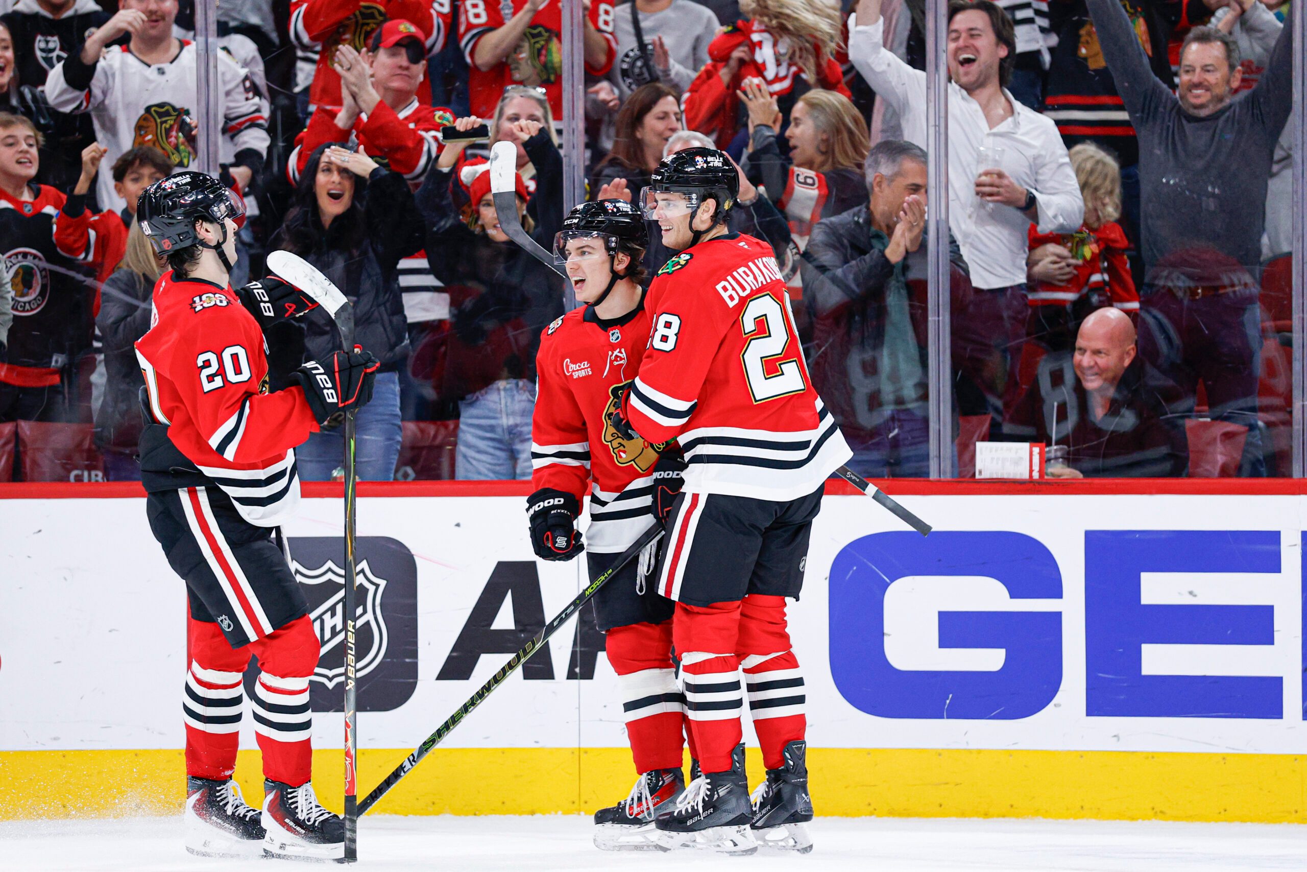 Nov 18, 2025; Chicago, Illinois, USA; Chicago Blackhawks center Connor Bedard (98) celebrates with teammates after scoring against the Calgary Flames during the second period at United Center. Mandatory Credit: Kamil Krzaczynski-Imagn Images