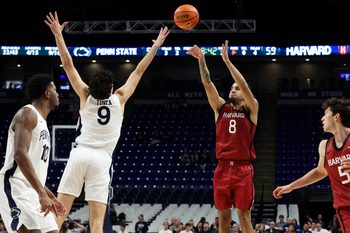 Nov 19, 2025; University Park, Pennsylvania, USA; Harvard Crimson guard Tey Barbour (8) shoots the ball defended by Penn State Nittany Lions guard Melih Tunca (9) during the second half at Bryce Jordan Center. Mandatory Credit: Matthew O'Haren-Imagn Images