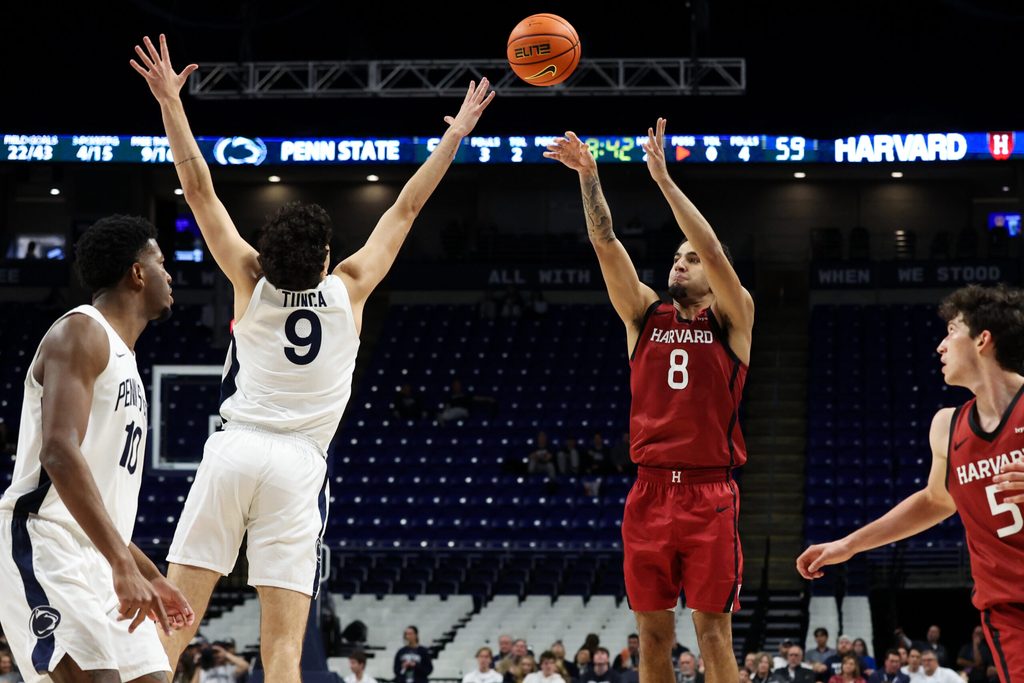 Nov 19, 2025; University Park, Pennsylvania, USA; Harvard Crimson guard Tey Barbour (8) shoots the ball defended by Penn State Nittany Lions guard Melih Tunca (9) during the second half at Bryce Jordan Center. Mandatory Credit: Matthew O'Haren-Imagn Images