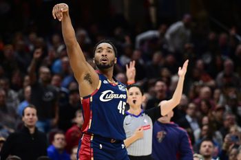 Nov 19, 2025; Cleveland, Ohio, USA; Cleveland Cavaliers guard Donovan Mitchell (45) shoots a three point shot surging the second half against the Houston Rockets at Rocket Arena. Mandatory Credit: David Dermer-Imagn Images
