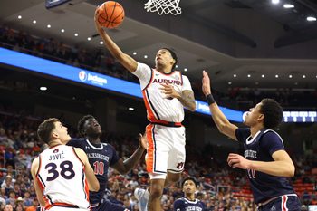 Nov 19, 2025; Auburn, Alabama, USA; Auburn Tigers guard Kaden Magwood (5) shoots the ball against the Jackson State Tigers during the second half at Neville Arena. Mandatory Credit: John Reed-Imagn Images