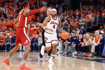 Nov 19, 2025; Chicago, Illinois, USA; Illinois Fighting Illini guard Kylan Boswell (4) brings the ball up court against Alabama Crimson Tide guard Labaron Philon (0) during the first half at United Center. Mandatory Credit: Kamil Krzaczynski-Imagn Images