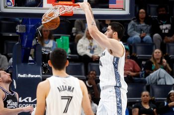 Nov 20, 2025; Memphis, Tennessee, USA; Memphis Grizzlies center Zach Edey (14) dunks during the second quarter against the Sacramento Kings at FedExForum. Mandatory Credit: Petre Thomas-Imagn Images