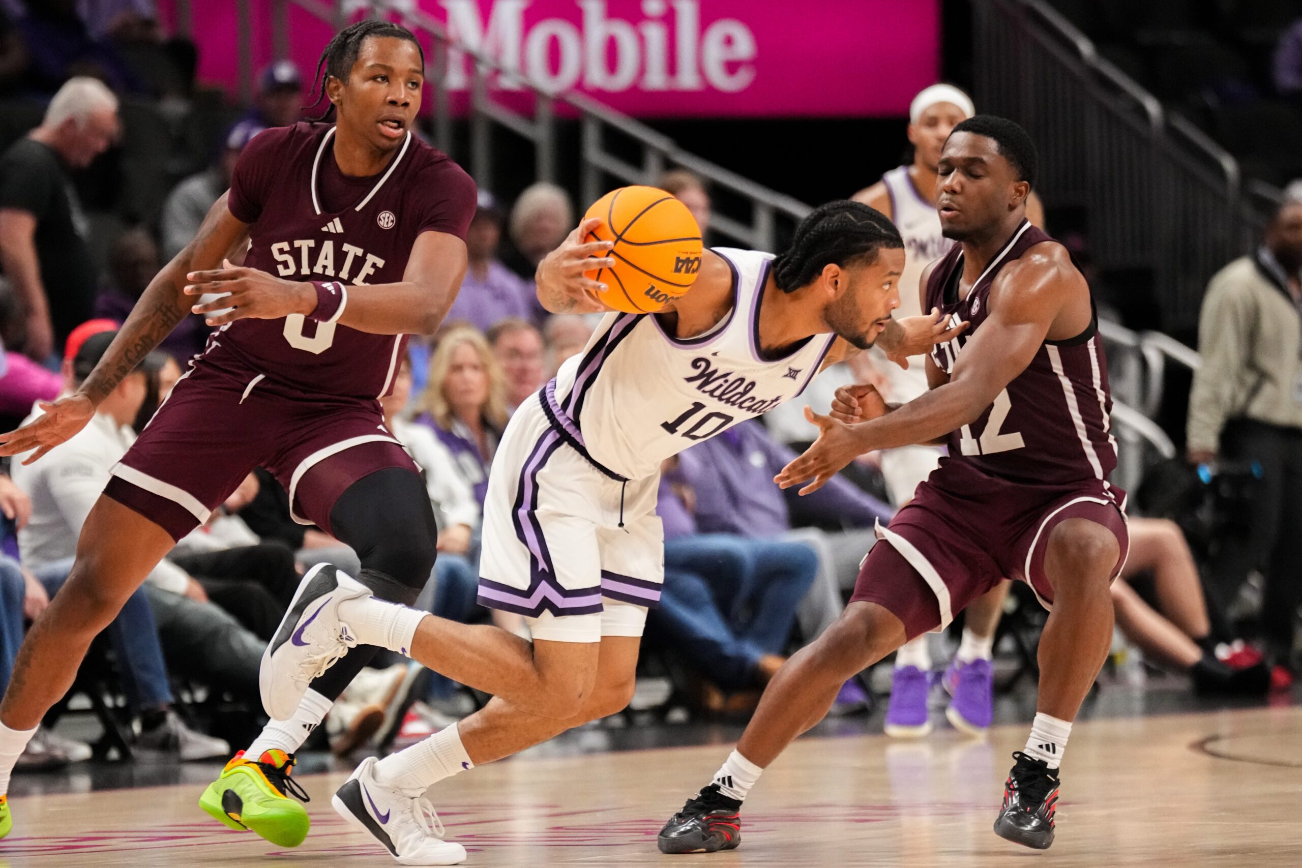 Nov 20, 2025; Kansas City, Missouri, USA; Kansas State Wildcats guard David Castillo (10) dribbles the ball as Mississippi State Bulldogs guard Josh Hubbard (12) defends during the second half of the game at T-Mobile Center. Mandatory Credit: Denny Medley-Imagn Images