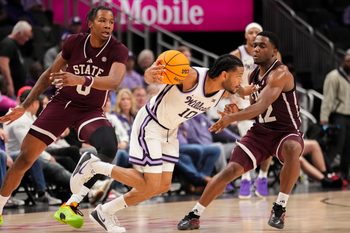 Nov 20, 2025; Kansas City, Missouri, USA; Kansas State Wildcats guard David Castillo (10) dribbles the ball as Mississippi State Bulldogs guard Josh Hubbard (12) defends during the second half of the game at T-Mobile Center. Mandatory Credit: Denny Medley-Imagn Images