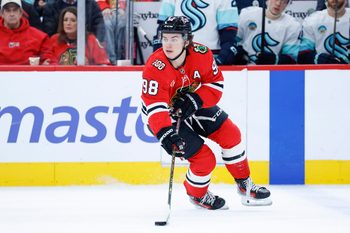 Nov 20, 2025; Chicago, Illinois, USA; Chicago Blackhawks center Connor Bedard (98) looks to pass the puck against the Seattle Kraken during the first period at United Center. Mandatory Credit: Kamil Krzaczynski-Imagn Images