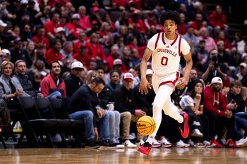 Louisville Cardinals guard Mikel Brown (0) handles the ball in the first half of the NCAA Basketball game between Louisville Cardinals and Cincinnati Bearcats at Heritage Bank Center in Cincinnati on Nov. 21, 2025.