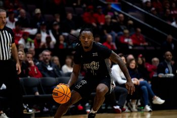 Cincinnati Bearcats guard Day Day Thomas (1) handles the ball in the second half of the NCAA Basketball game at Heritage Bank Center in Cincinnati on Nov. 21, 2025.