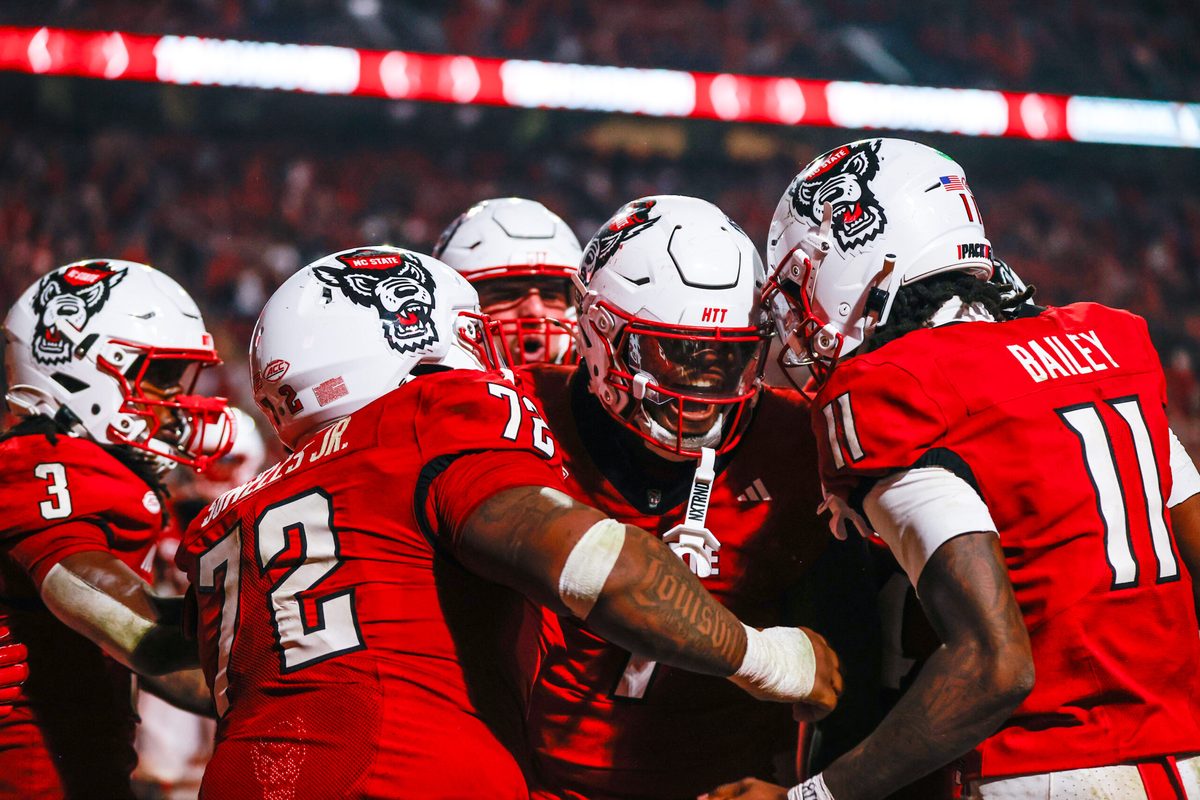 Nov 21, 2025; Raleigh, North Carolina, USA;  NC State Wolfpack tight end Justin Joly (7) celebrates his touchdown to win the game during the second half of the game against Florida State Seminoles at Carter-Finley Stadium. Mandatory Credit: Jaylynn Nash-Imagn Images