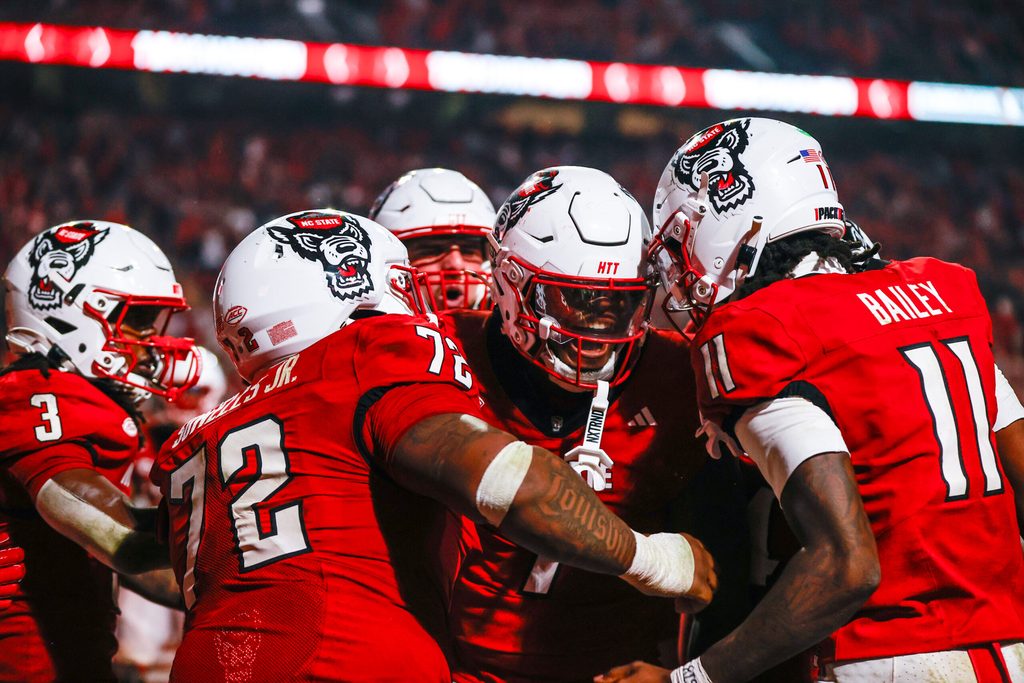 Nov 21, 2025; Raleigh, North Carolina, USA; NC State Wolfpack tight end Justin Joly (7) celebrates his touchdown to win the game during the second half of the game against Florida State Seminoles at Carter-Finley Stadium. Mandatory Credit: Jaylynn Nash-Imagn Images