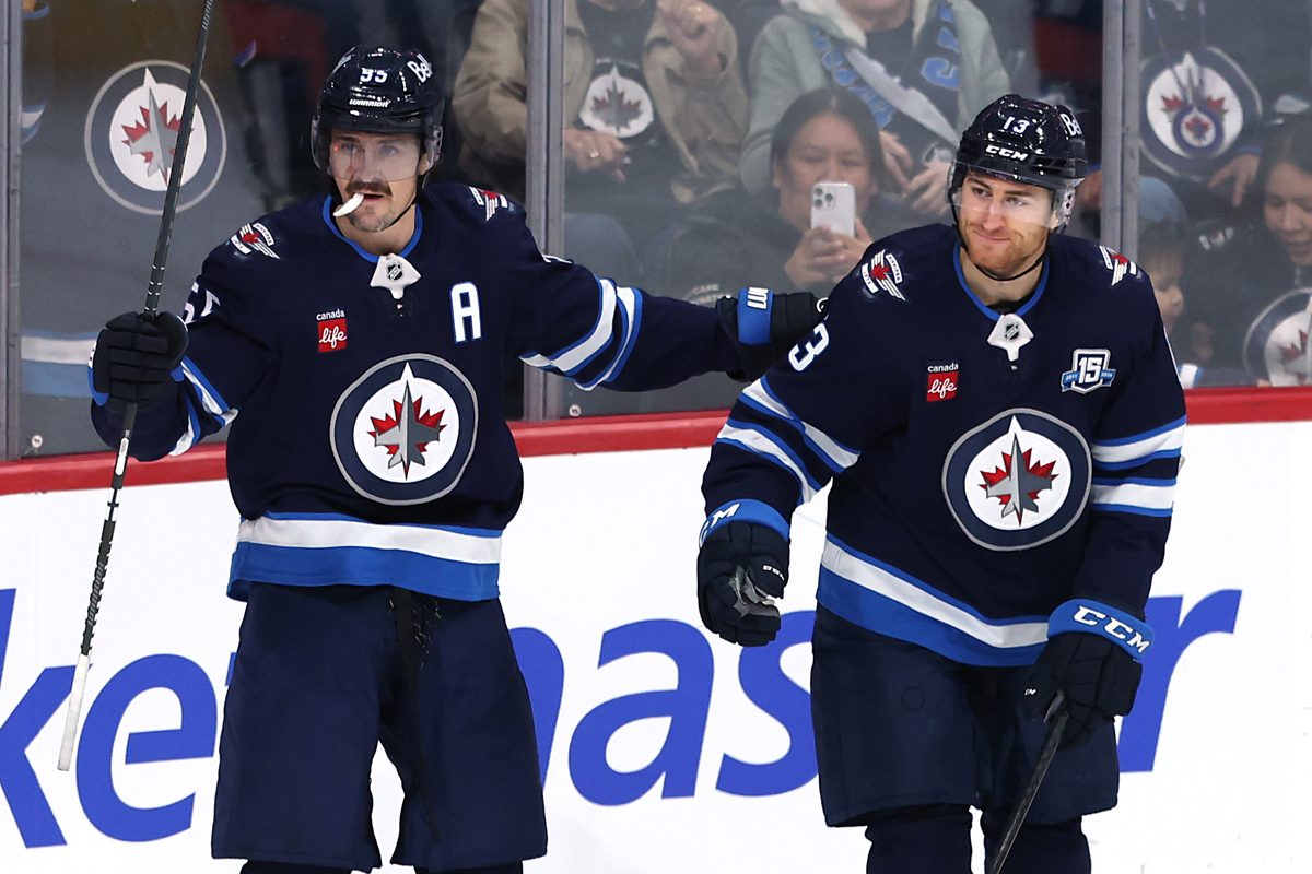 Nov 21, 2025; Winnipeg, Manitoba, CAN; Winnipeg Jets center Gabriel Vilardi (13) celebrates scoring against the Carolina Hurricanes with center Mark Scheifele (55) in the first period at Canada Life Centre. Mandatory Credit: James Carey Lauder-Imagn Images