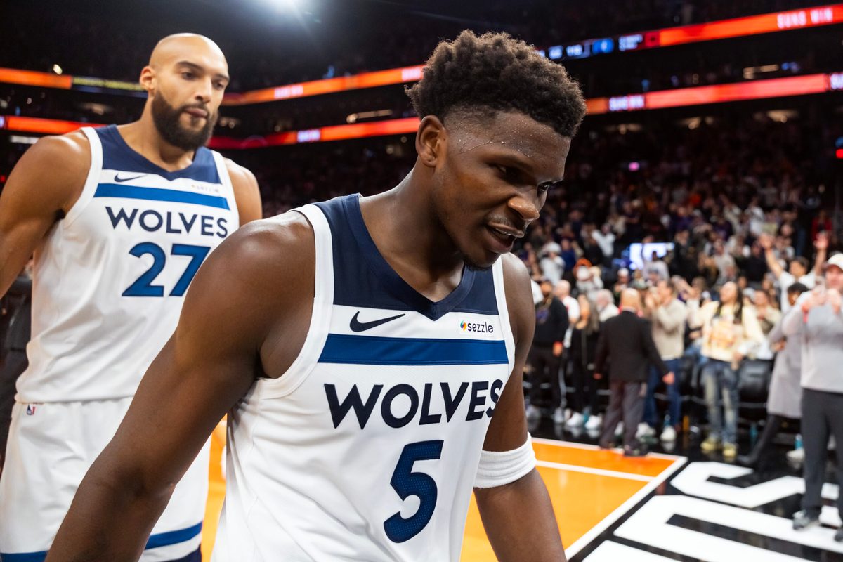Nov 21, 2025; Phoenix, Arizona, USA; Minnesota Timberwolves guard Anthony Edwards (5) and center Rudy Gobert (27) react as they walk off the court after losing to the Phoenix Suns in the second half of an NBA Cup game at Mortgage Matchup Center. Mandatory Credit: Mark J. Rebilas-Imagn Images