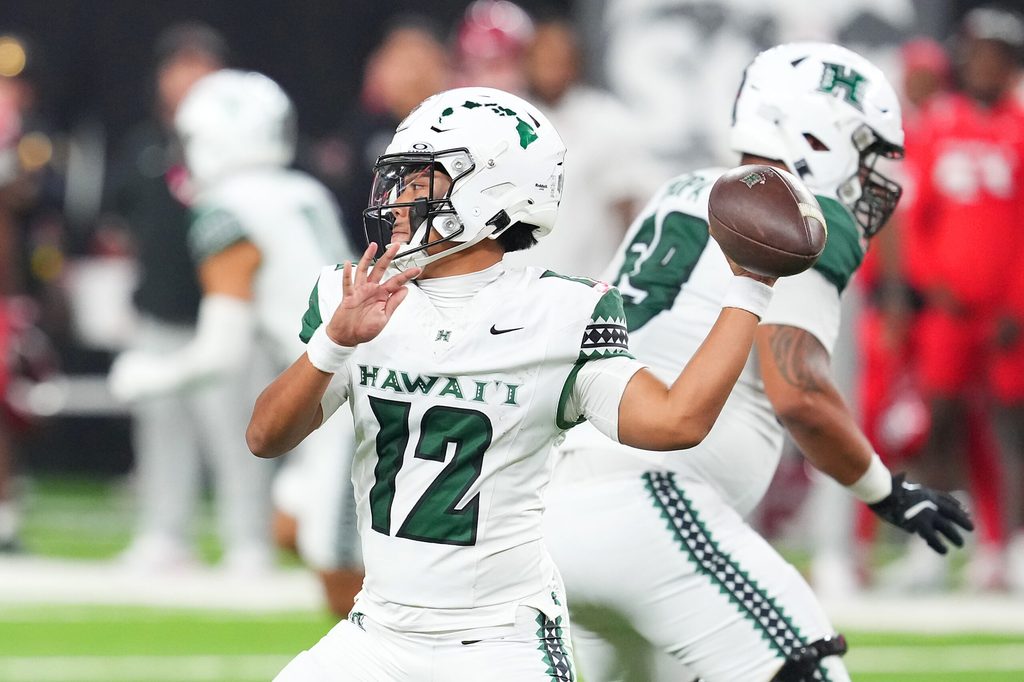 Nov 21, 2025; Paradise, Nevada, USA; Hawaii Rainbow Warriors quarterback Micah Alejado (12) looks to make a pass against the UNLV Rebels during the fourth quarter at Allegiant Stadium. Mandatory Credit: Stephen R. Sylvanie-Imagn Images