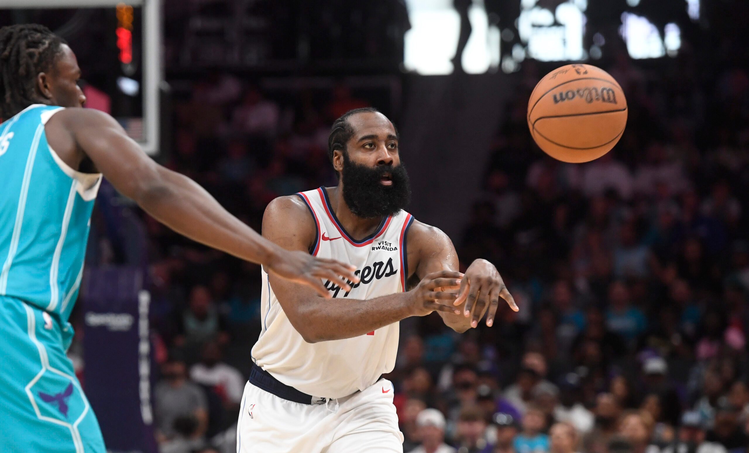 Nov 22, 2025; Charlotte, North Carolina, USA; Los Angeles Clippers guard James Harden (1) passes during the second half against the Charlotte Hornets at the Spectrum Center. Mandatory Credit: Sam Sharpe-Imagn Images